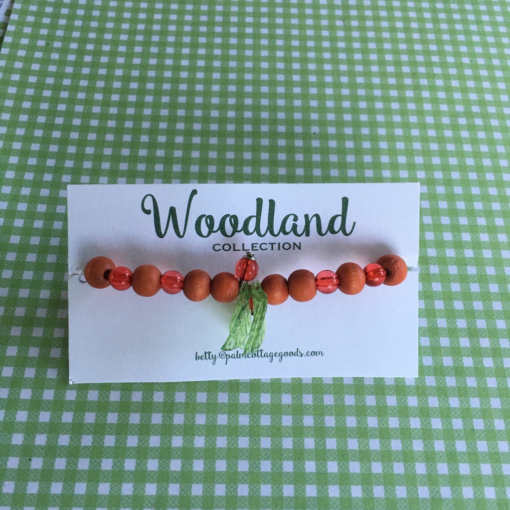 Wooden And Lucite Beads With Green Leaves.